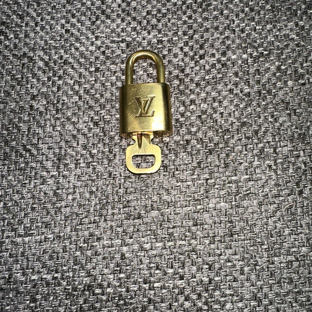 Louis Vuitton Luxurious Gold Lock 310